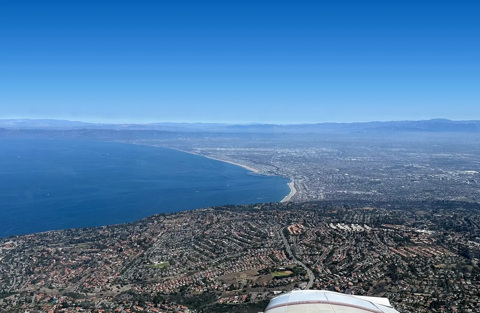 The Southern California coastline from the wing during a flight